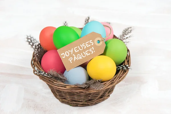 Easter eggs in basket with decoration — Stock Photo, Image