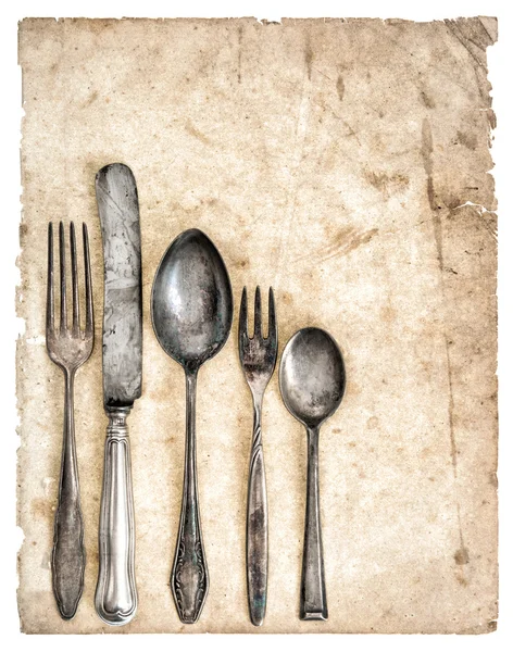 Antique cutlery and old cook book page — Stock Photo, Image