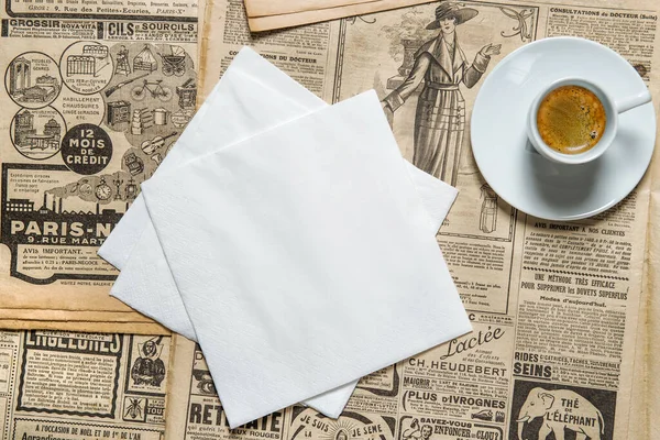 Napkin mockup and cup coffee on vintage style background