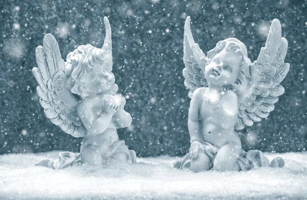 Little guardian angels in snow. christmas decoration — Stock Photo, Image