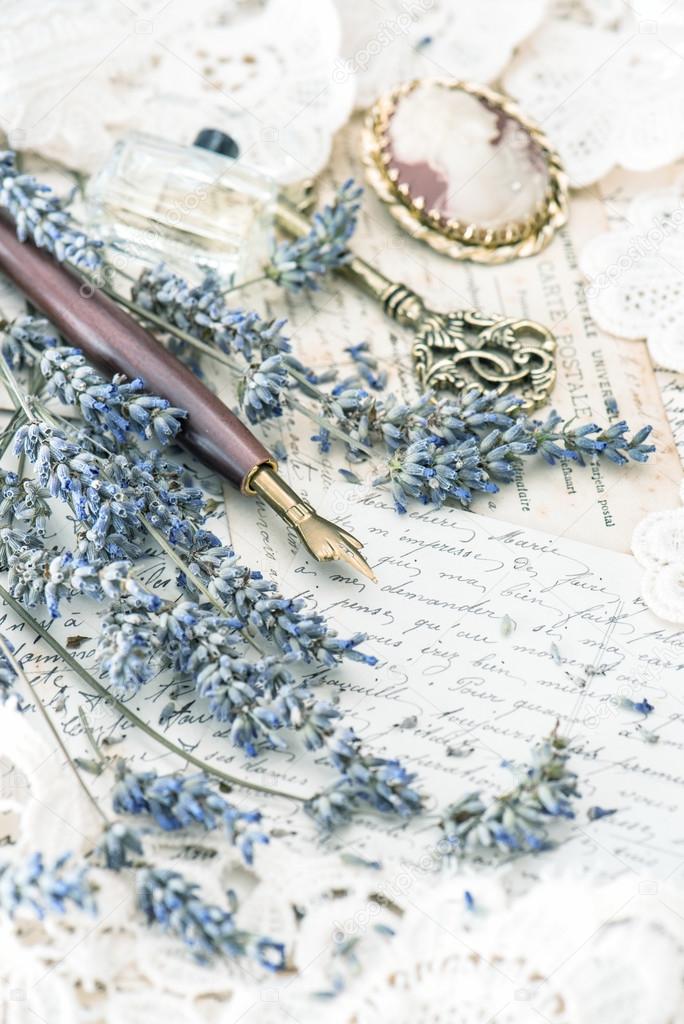 vintage ink pen, key, perfume, lavender flowers and old love let