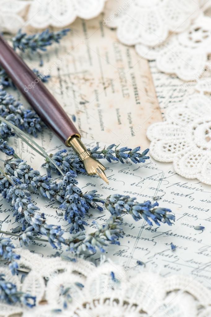 vintage ink pen, dried lavender flowers and old love letters
