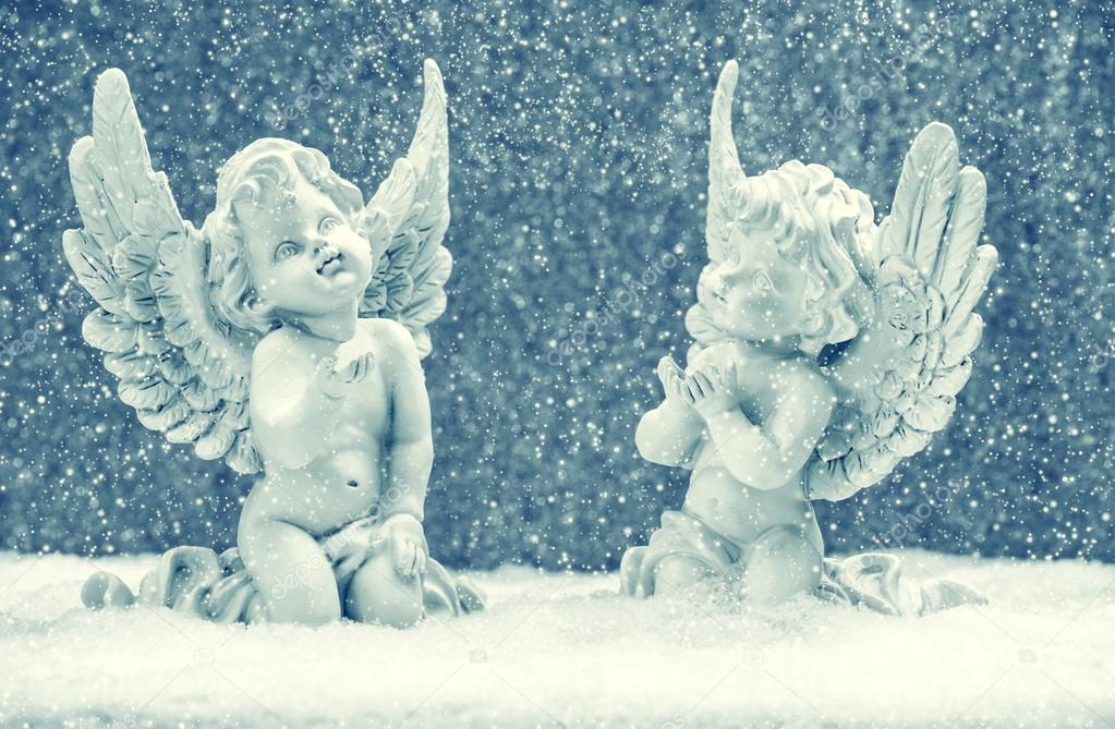 little guardian angels in snow. christmas decoration