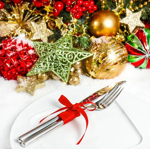 Christmas tree branches with decorations in red and gold — Stock Photo, Image