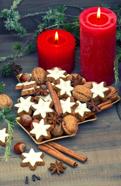 Cinnamon cookies, nuts and spices with christmas decoration — Stock Photo, Image