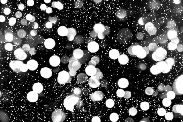 Defocused lights with snowfall effect. winter night. abstract ba — Stock Photo, Image