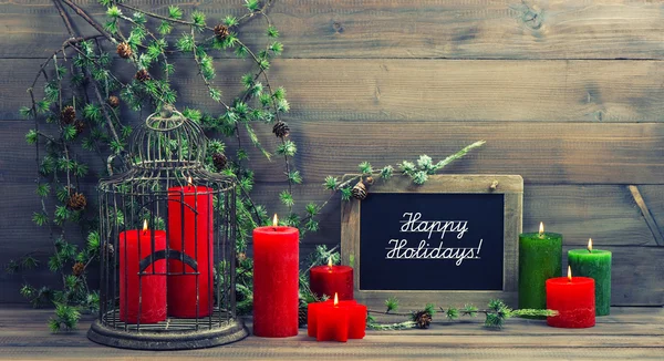 Christmas decoration red candles and pine branch — Stock Photo, Image