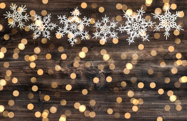 Christmas decoration snowflakes and defocused lights — Stock Photo, Image