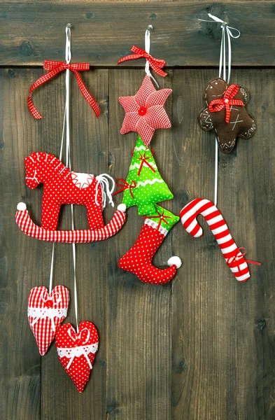 Christmas decoration handmade toys hanging over wooden backgroun — Stock Photo, Image