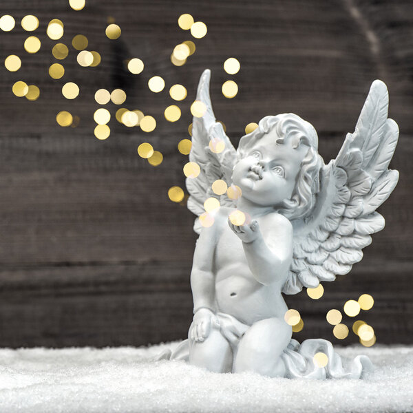 little guardian angel with shiny lights. christmas decoration