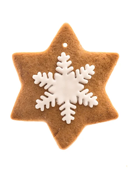 Gingerbread star shaped cookie with icing snowflake — Stock Photo, Image