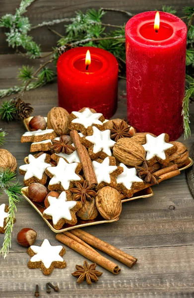 Cinnamon cookies, nuts and spieces with christmas decoration — Stock Photo, Image