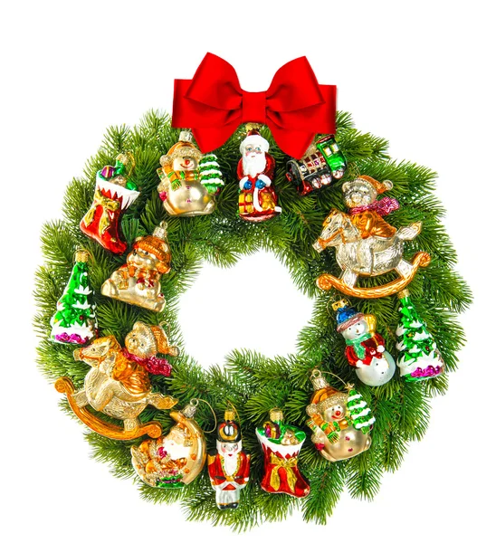 Christmas wreath decorated with ornaments and red ribbon bow — Stock Photo, Image