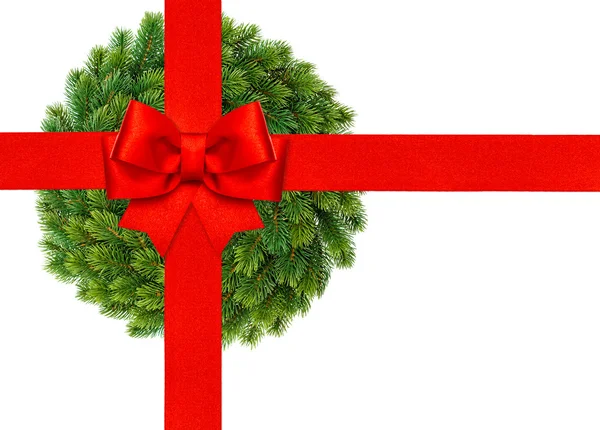 Red ribbon bow with christmas wreath isolated on white — Stock Photo, Image