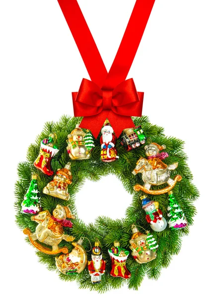 Christmas wreath decorated with ornaments and red ribbon bow — Stock Photo, Image