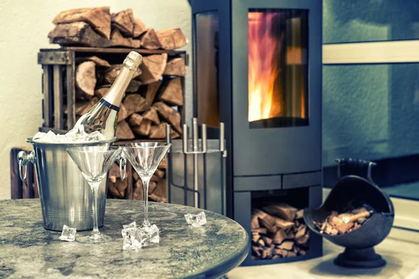 Festive home interior wirh champagne and fireplace — Stock Photo, Image