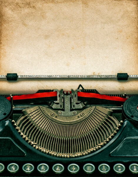 Vintage typewriter with textured grungy paper