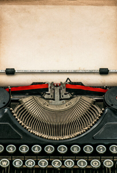 Antique typewriter with aged paper