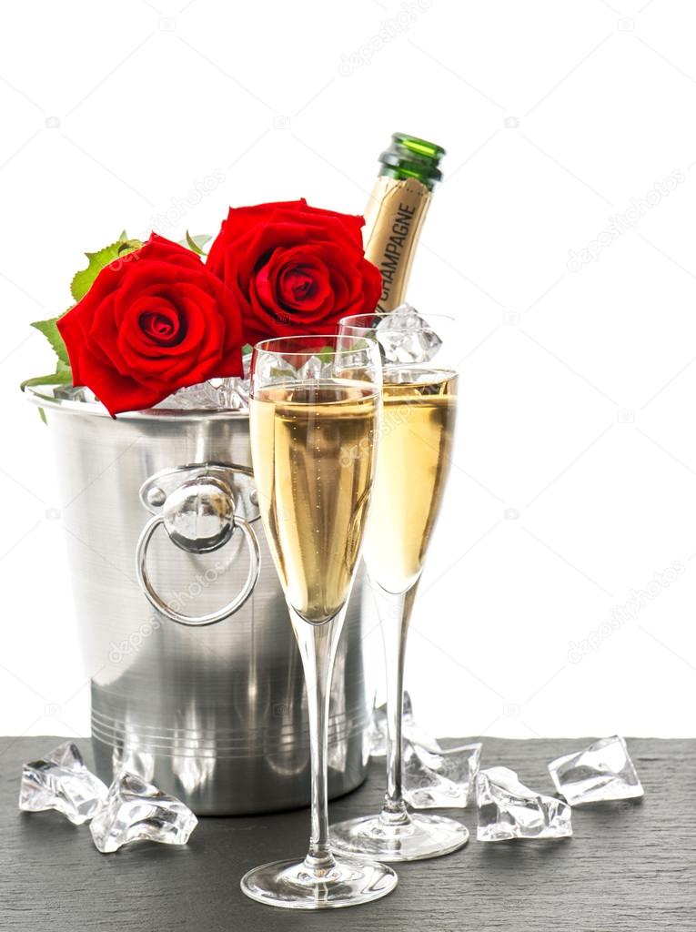 Champagne, two glasses and red roses