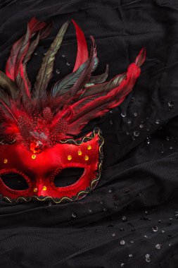 Red venetian carnival mask with feather clipart