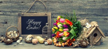 Easter decoration with eggs and tulip flowers. Retro style toned