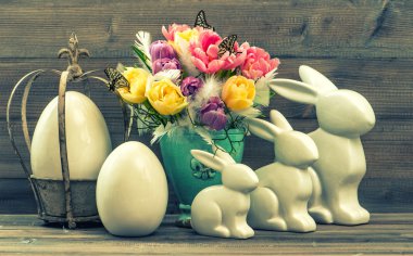 Vintage decoration with tulip flowers, easter eggs and bunnies