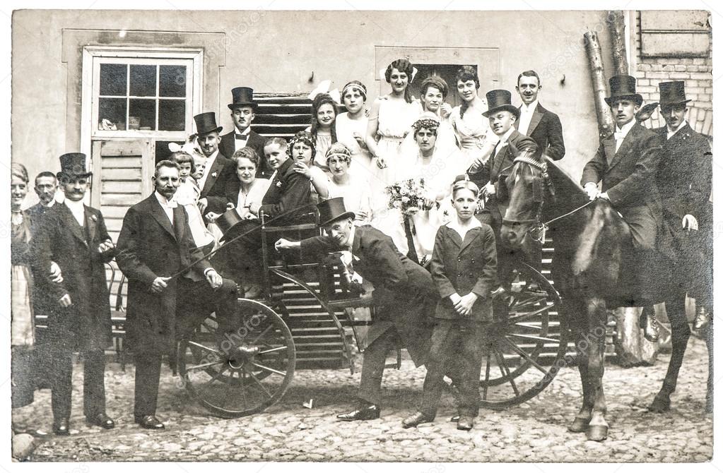 Antique wedding photo with people in vintage clothing