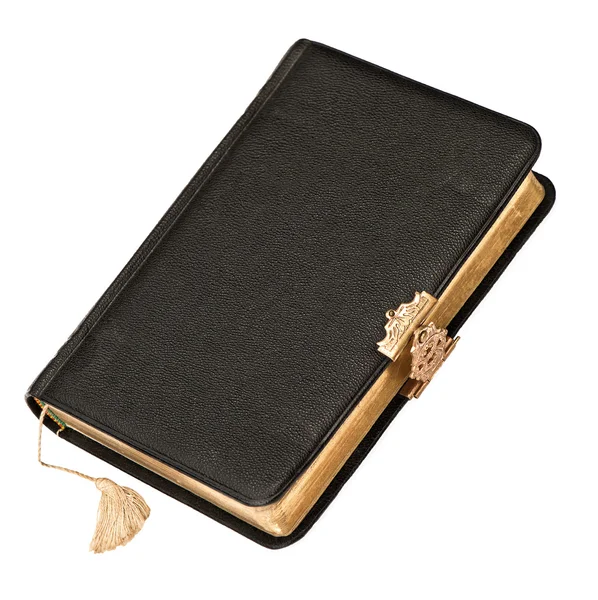 Leather cover book with golden decoration isolated on white — Stockfoto