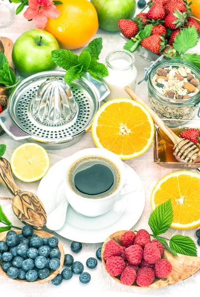 Breakfast table setting with coffee, croissants, granola, honey. — Stock Photo, Image