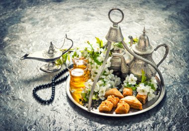 Ramadan kareem. Tea glasses and pot, traditional delight baklava