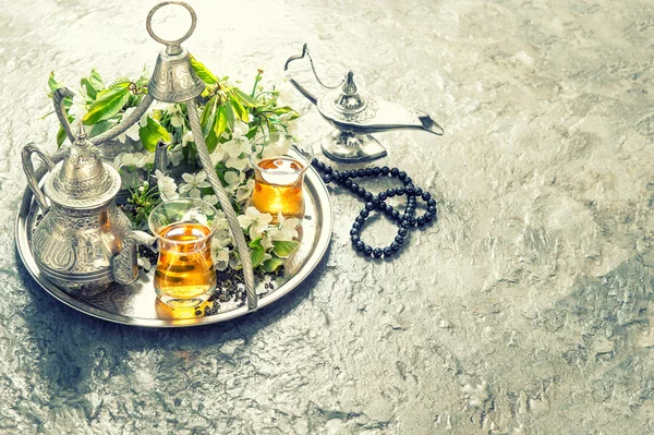 Tea table setting with arabian lantern and rosary. Islamic holid — Stockfoto