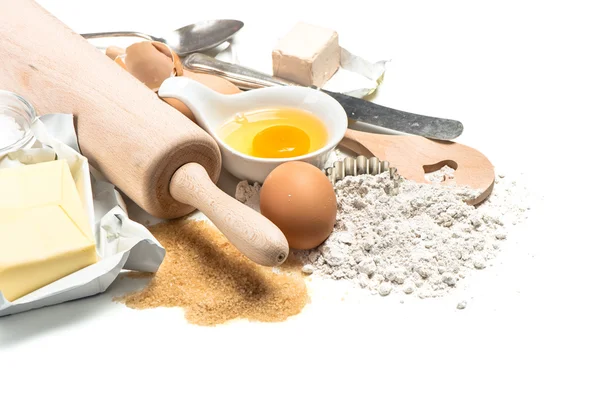 Baking ingredients flour, eggs. Wooden kitchen utensils. Food ba — Zdjęcie stockowe