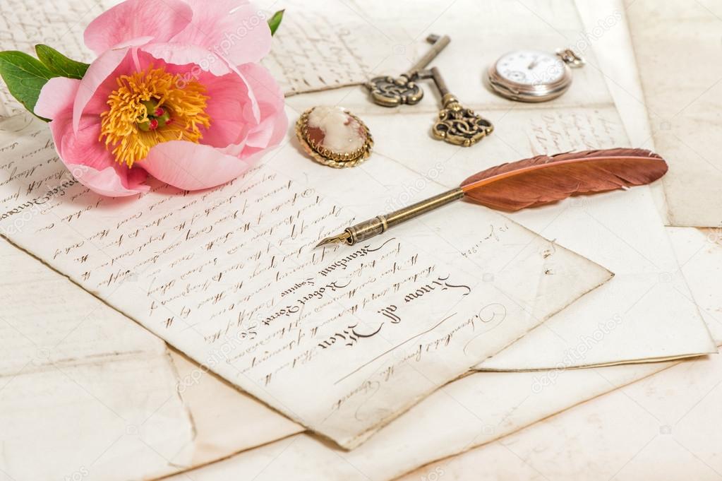 Old letters, pink peony flower and antique feather pen. Vintage 