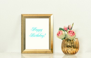 Picture mock up with golden frame amd flowers. Happy Birthday