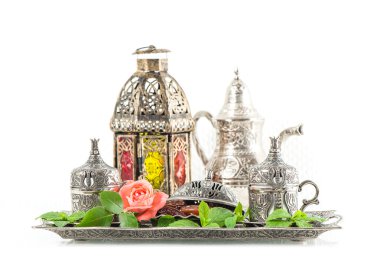 Ramadan kareem. Tea table setting withdates, mint leaves and ros