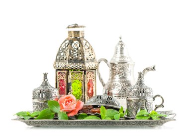 Ramadan kareem. Tea table setting withdates, mint leaves and ros