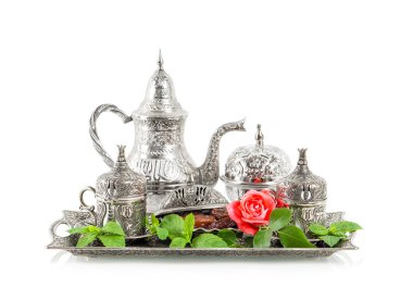 Holidays table setting with mint leaves and rose flower. Ramadan