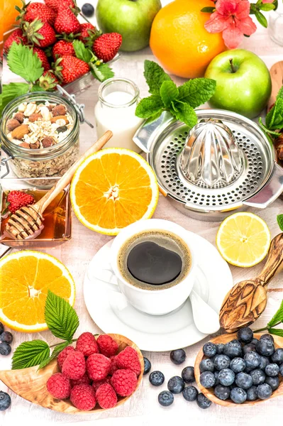 Breakfast table setting with coffee, croissants, granola, honey. — Stock Photo, Image