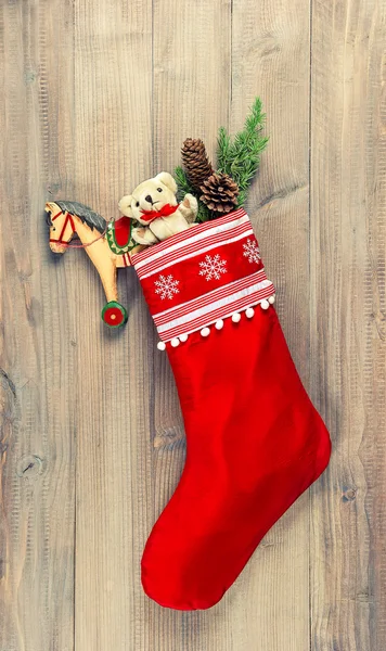 Christmas stocking with nostalgic vintage toys decoration — Stock Photo, Image