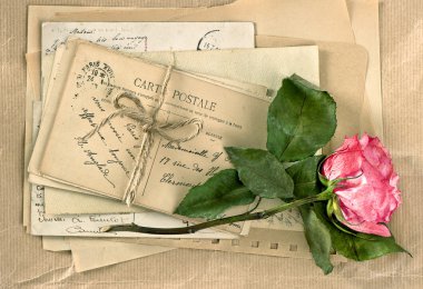 Old letters and rose flower. Vintage handwriting. Retro style