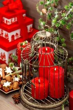 Christmas decorations, gift box, red candles, pine branches