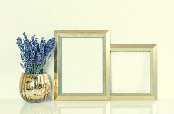 Golden picture frame and lavender flowers. Vintage style toned — 图库照片