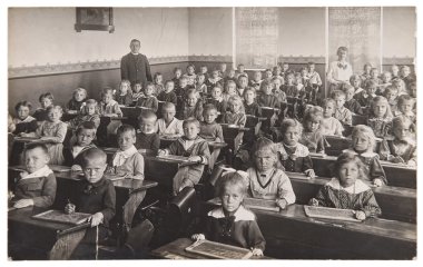 Children and teacher in the classroom. Back to school concept