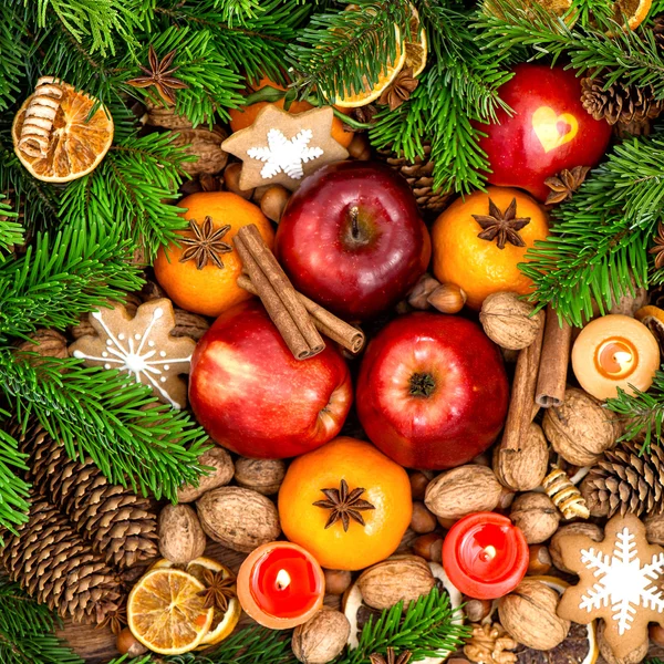 Christmas food backdround. Fruits, nuts, spices and cookies — Stok fotoğraf