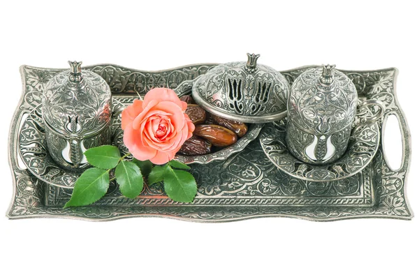 Tea table setting withdates, mint leaves and rose flower — Stock Photo, Image