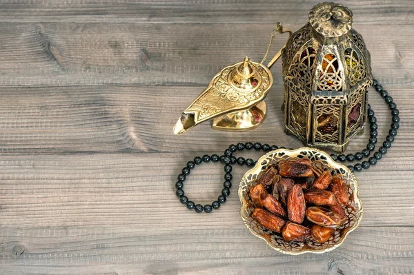 Dates, arabian lantern and rosary. Eid Mubarak — Stock Photo, Image