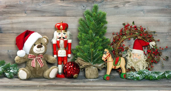 Christmas decoration. Antique toys Teddy Bear and Nutcracker — Stock Photo, Image
