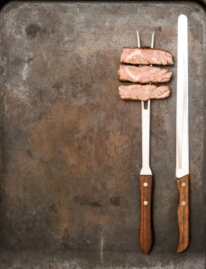 Izgara Dana eti çatal ve bıçak. Gıda arka plan