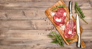 Raw meat Ribeye Steak with herbs and spices