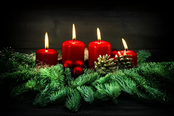 Advent decoration. Four red burning candles. Vintage style — Stockfoto